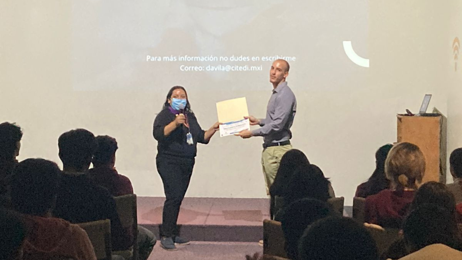 Another presenting shot with audience